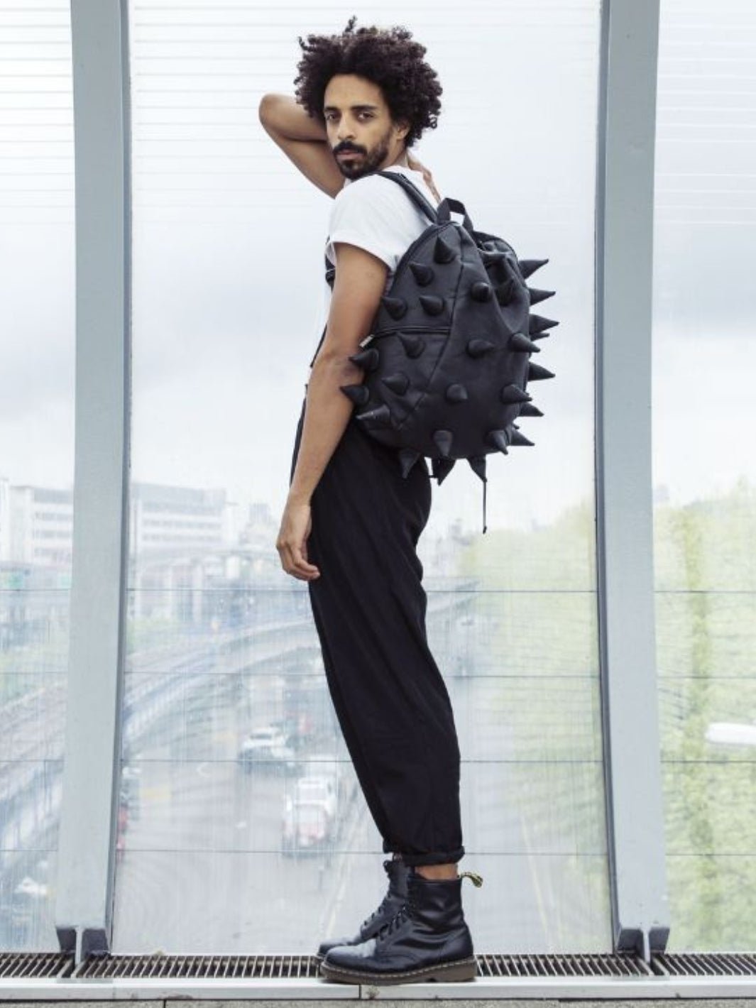 Man in Front of Window Wearing Got Your Black - Black Backpack | Madpax