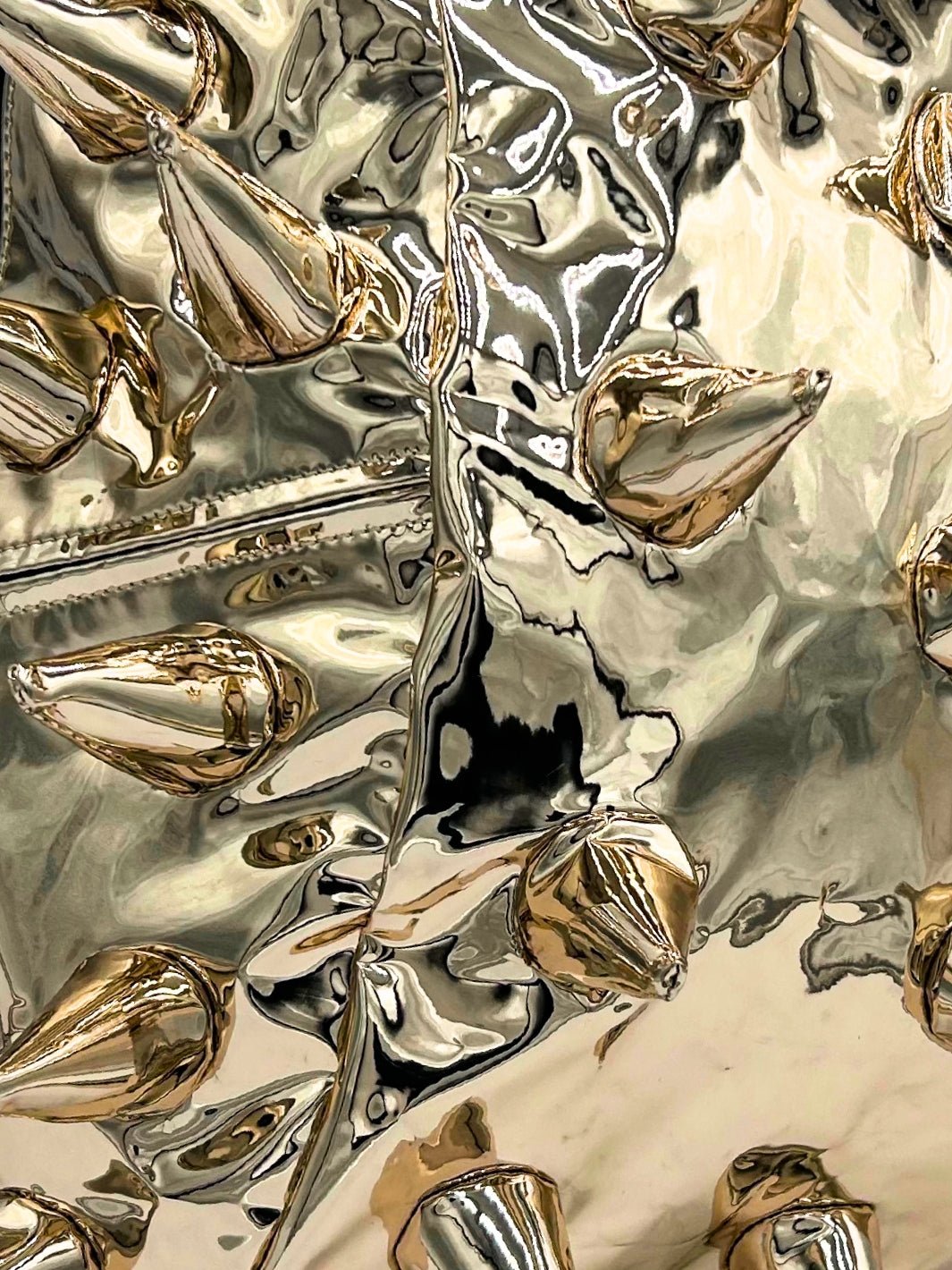 Up Close View of 24 Karat Metallic Gold Backpack | Madpax